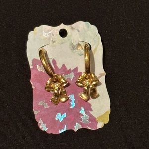 Gold colored hoops with bow.